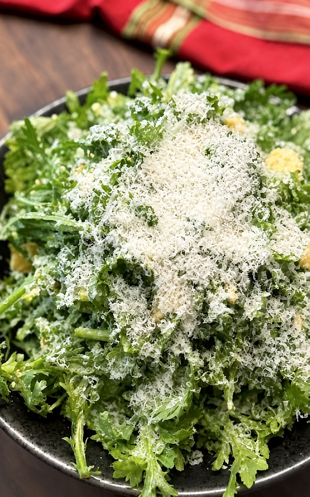 Chrysanthemum salad topped with finely grated Parmesan